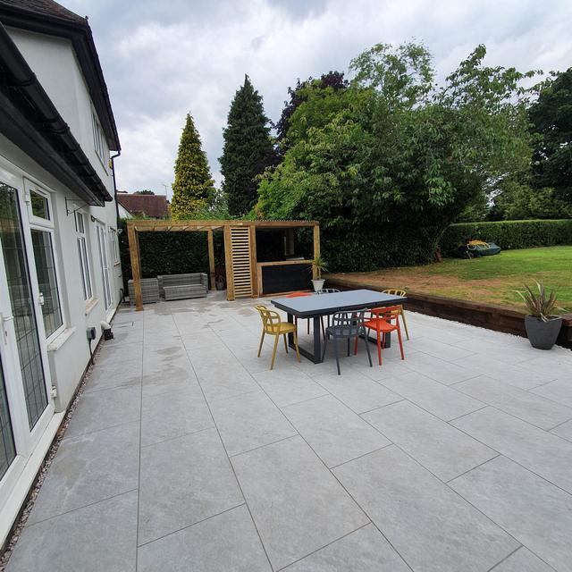 Large porcelain patio with dining set