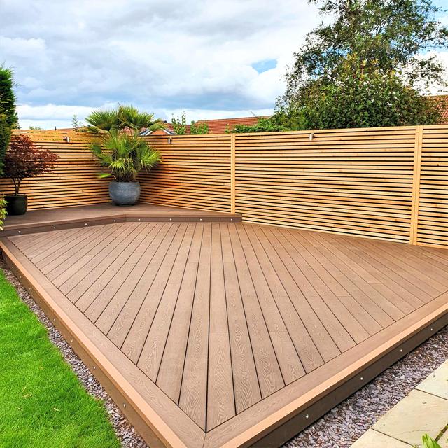 Composite decking with slatted privacy fence
