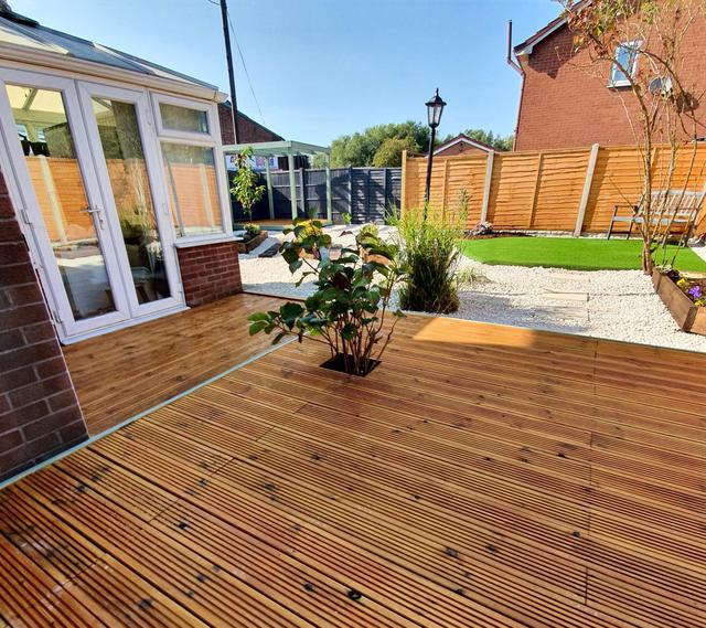 Timber decking outside a conservatory