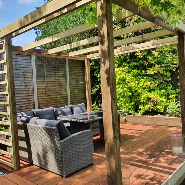 Timber pergola over a deck with outdoor seating